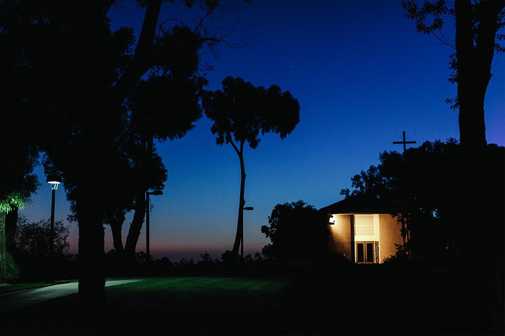 The Good Shepherd Chapel hilltop at night is a great vantage point to catch Disneyland’s fireworks.